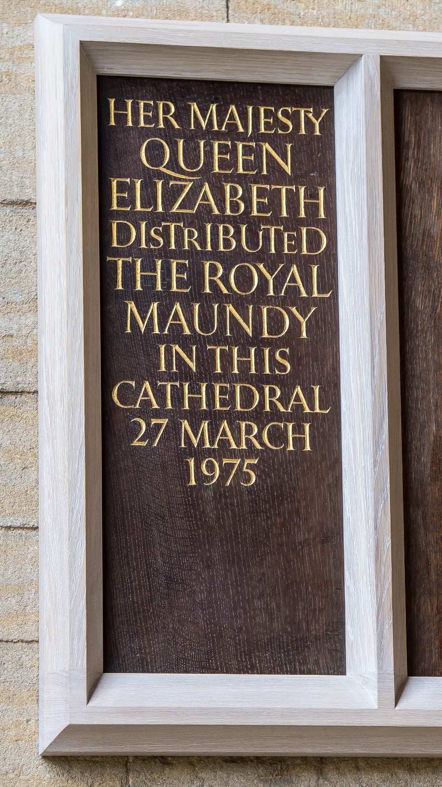 A plaque commemorating Queen Elizabeth II giving the Maundy Money at Peterborough Cathedral, 1975